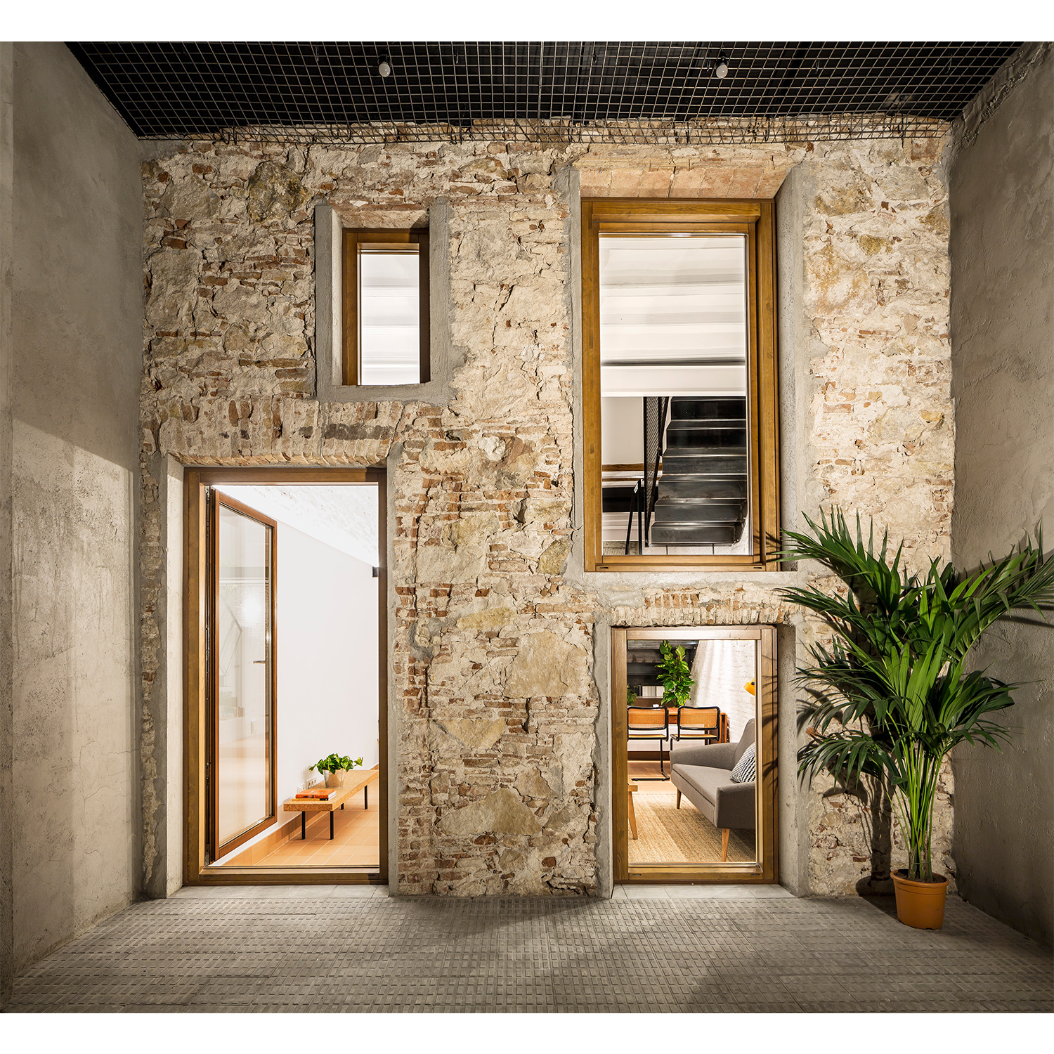 CRU innovative house renovation project in Barcelona. La Diana, a transformed local into a ground floor residence with two floors.