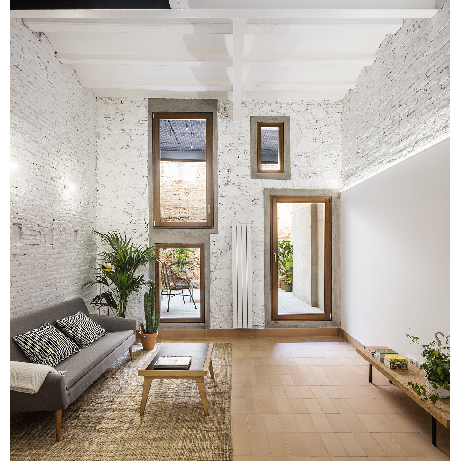 CRU innovative house renovation project in Barcelona. La Diana, a transformed local into a ground floor residence with two floors.