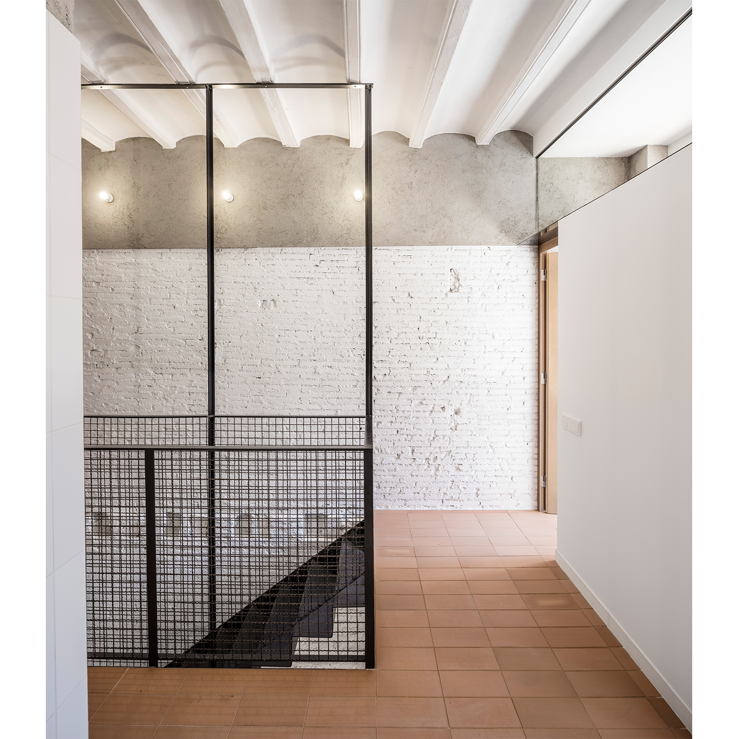 CRU innovative house renovation project in Barcelona. La Diana, a transformed local into a ground floor residence with two floors.