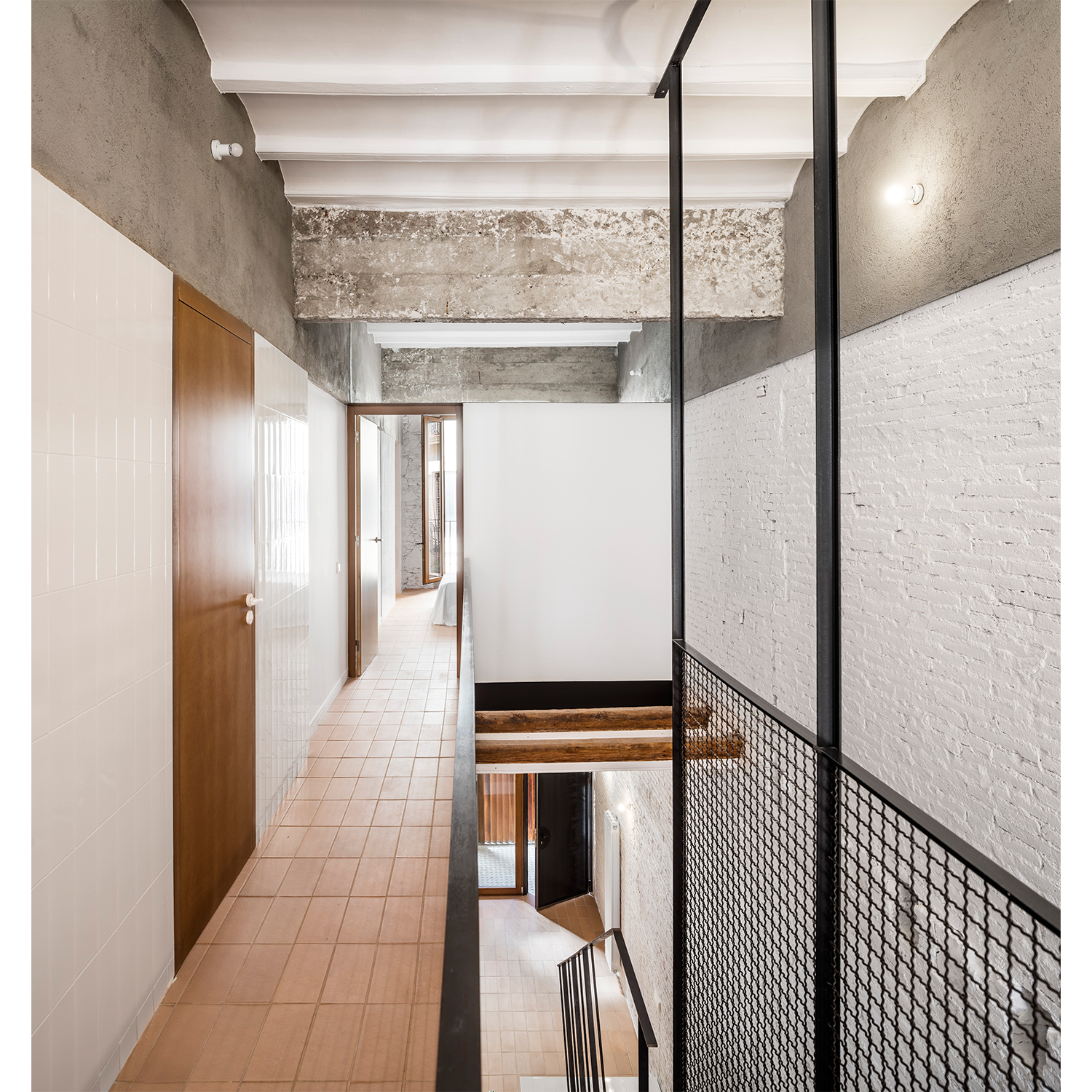 CRU innovative house renovation project in Barcelona. La Diana, a transformed local into a ground floor residence with two floors.