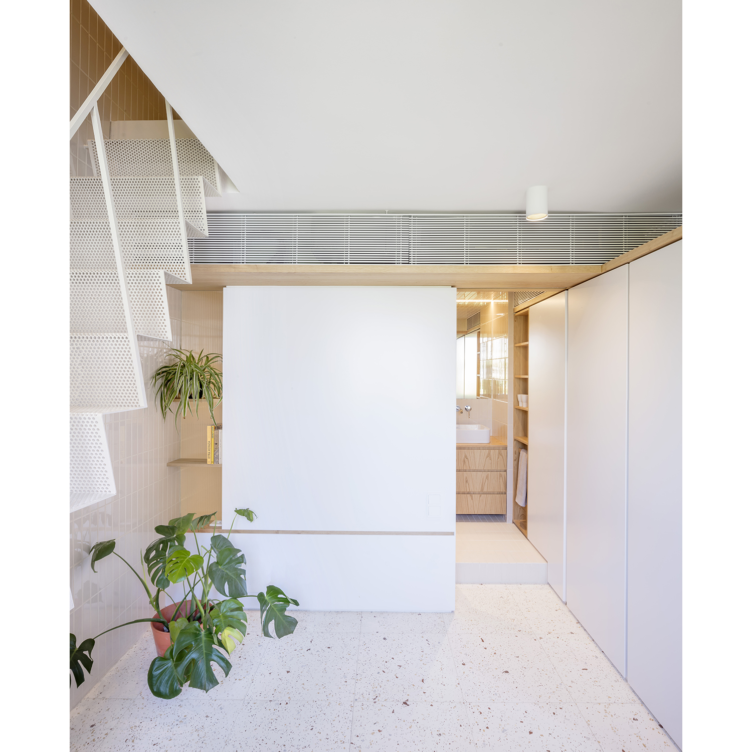 CRU innovative flat renovation project in Barcelona. La Fleur, micro-apartment with an upper terrace accessible from a retractable staircase