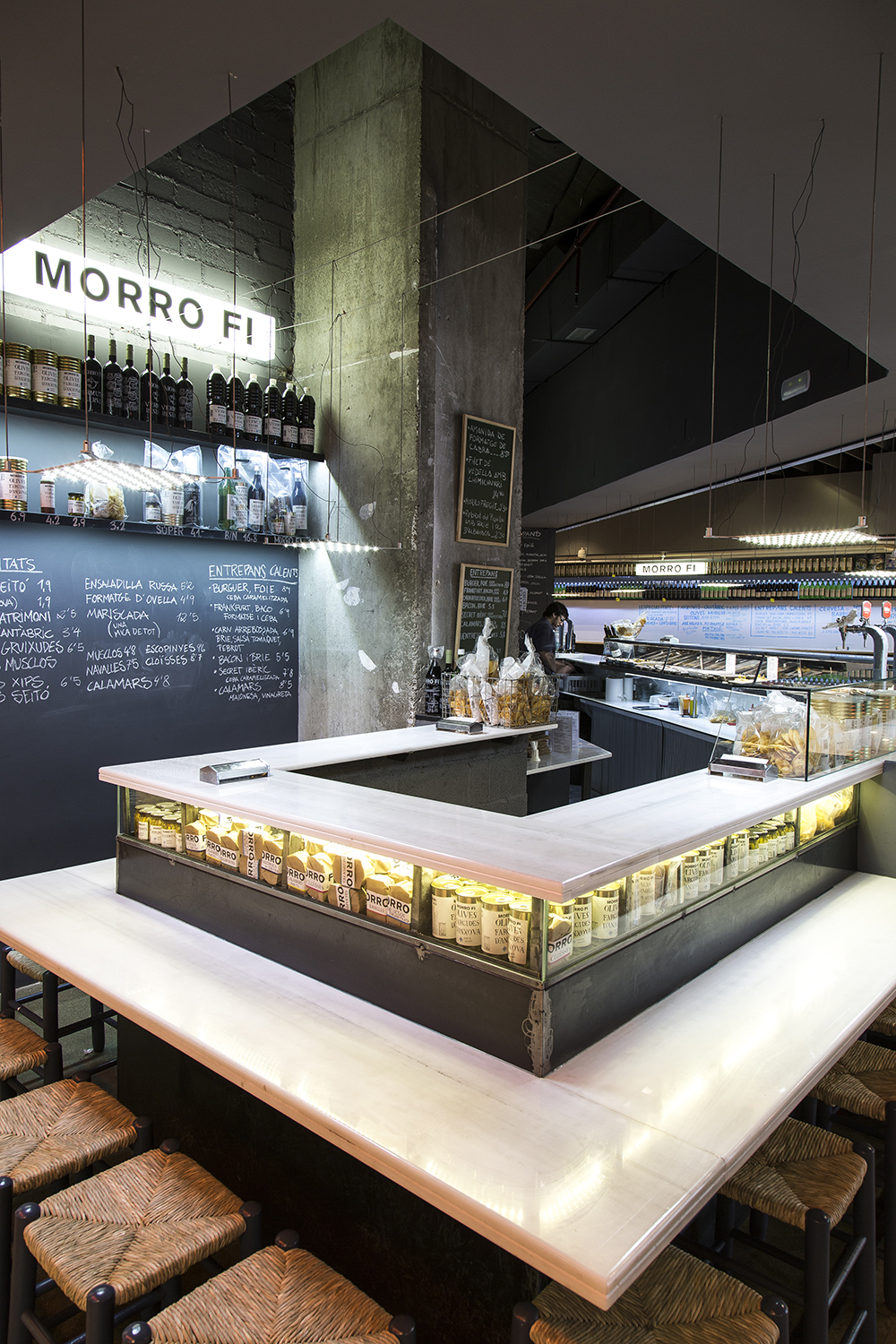 CRU innovative restaurant project in Barcelona. El Morro fi, a patchwork made of iron, led lighting, vermouth and pickles.