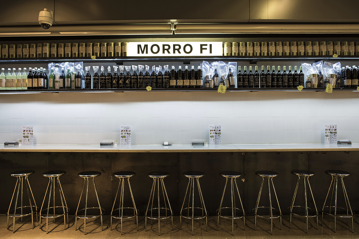 CRU innovative restaurant project in Barcelona. El Morro fi, a patchwork made of iron, led lighting, vermouth and pickles.