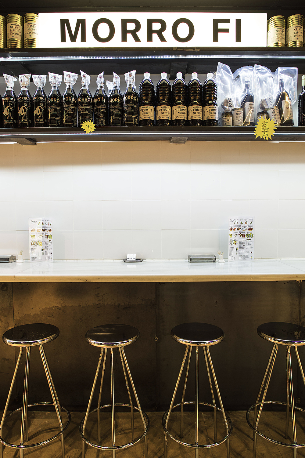 CRU innovative restaurant project in Barcelona. El Morro fi, a patchwork made of iron, led lighting, vermouth and pickles.