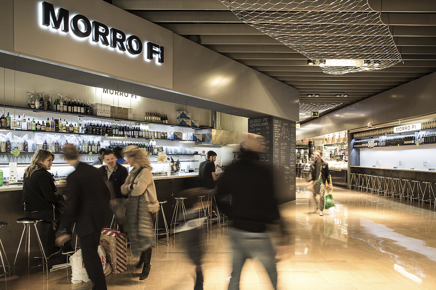 CRU innovative restaurant project in Barcelona. El Morro fi, a patchwork made of iron, led lighting, vermouth and pickles.